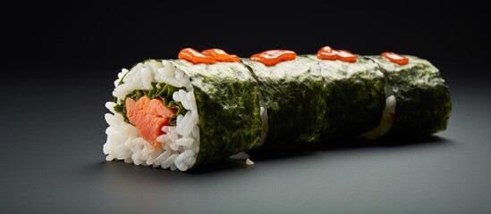 Fototapete - Delicious sushi roll filled with fresh salmon and a variety of vegetables on top. with copy space image. Place for adding text or design