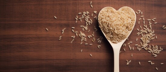 Leinwandbilder - Close-up of a spoon holding rice on a rustic wooden table, showcasing the texture and simplicity of grains. with copy space image. Place for adding text or design