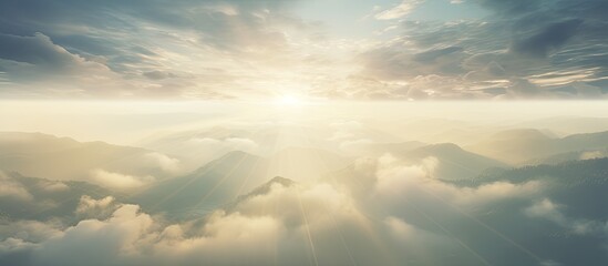 Fototapete - Mountain range under sunbeam, aerial view capturing misty sunshine rays. with copy space image. Place for adding text or design
