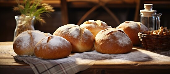 Aufkleber - Some loaves of bread are displayed on a table alongside a basket of nuts. with copy space image. Place for adding text or design