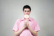 © Miriana - Young man eating lollipop