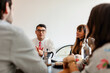 © ByLorena/Stocksy - Diverse startup entrepreneurs meeting