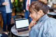 © ByLorena/Stocksy - Startup Woman with laptop at coffee shop