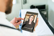 © Sean Locke/Stocksy - Doctor Uses Tablet For Telemedicine Session With Female Patient