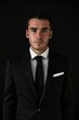 © vefimov - A business professional posing for a photo, dressed in a suit and tie