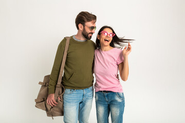 Wall Mural - couple smiling woman and man in sweatshirt with travel bag