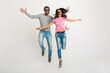 © mary_markevich - hipster stylish couple jumping pretty smiling emotional woman and man