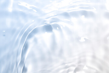 Wall Mural - the clear blue surface of the water gradients from light to dark.