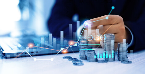 Leinwandbilder - Businessman hand putting money coin stack with growing business graph. Saving money concept. Financial growth data or investment market profit bar and success report.