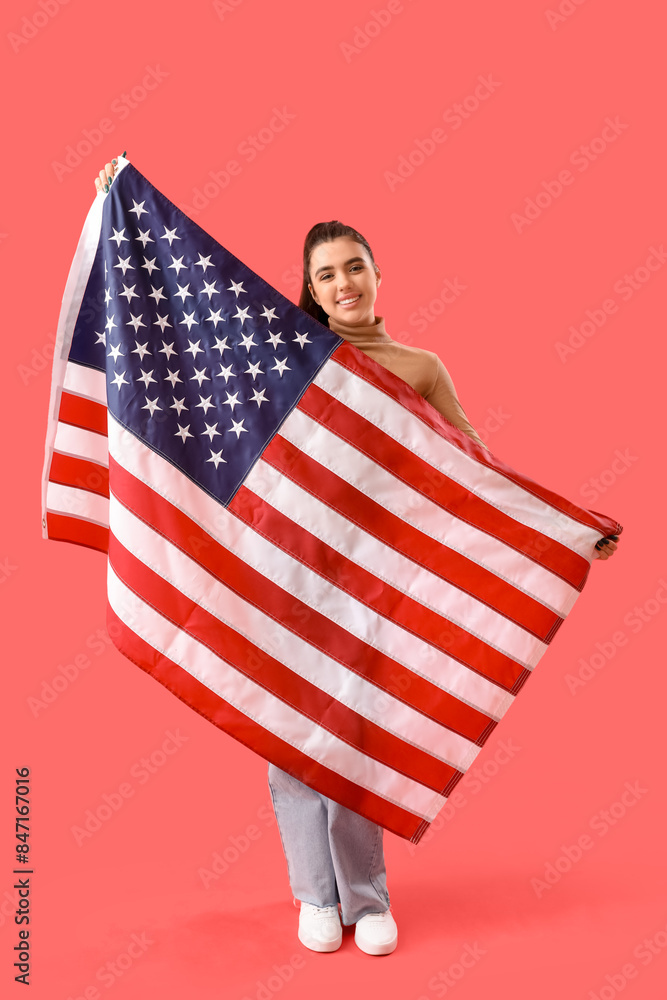 Young woman with USA flag on red background