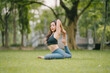 © Kritdanai - Young asian woman is practicing yoga exercises in the morning, yoga relax outdoor concept