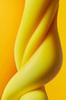 © Yaroslav Danylchenko/Stocksy - Creative pattern of twisted yellow toy slime in studio