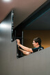 © Ezequiel Giménez/Stocksy - Focused man fixing panel on LED video wall