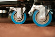 © Ezequiel Giménez/Stocksy - Caster roller wheels supported with metal handle