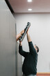 © Ezequiel Giménez/Stocksy - Engineers assembling the LED panel