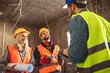 © Mediteraneo - Construction team planning a building blueprint project on site with collaboration for architect innovation. Architecture, design and engineers with teamwork for successful
