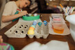 © Jessica Byrum/Stocksy - Easter Crafts At The Kitchen Table