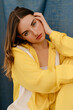 © Tania Cervian/Stocksy - Woman in yellow dress sitting