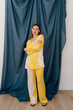© Tania Cervian/Stocksy - Attractive woman standing in nightwear