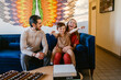 © ByLorena/Stocksy - Joyful family at small business
