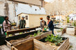 © BONNINSTUDIO/Stocksy - Group of volunteers working in community garden