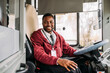 © Studio Firma/Stocksy - Bus driver posing
