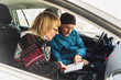 © Diego Martin/Stocksy - Senior couple sitting inside the car