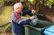© Diego Martin/Stocksy - Senior man taking out the trash