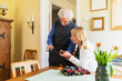 © Diego Martin/Stocksy - Senior couple at home using digital tablet at home