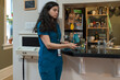 © Tessy Morelli/Stocksy - Professional nurse charging her phone