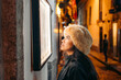 © Carlos Gonzales/Stocksy - Woman Reading a Restaurant Menu in Cusco Peru
