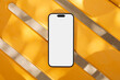 © Artem Podrez/Stocksy - Mockup phone With White Screen on Yellow Design Chair