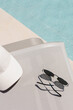© Artem Podrez/Stocksy - Summer Poolside Accessories: Hat and Sunglasses