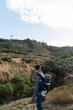 © Serena Burroughs/Stocksy - young father hiking in san diego california with son in baby carrier