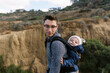 © Serena Burroughs/Stocksy - young father hiking in san diego california with son in baby carrier