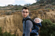 © Serena Burroughs/Stocksy - young father hiking in san diego california with son in baby carrier