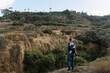 © Serena Burroughs/Stocksy - young father hiking in san diego california with son in baby carrier