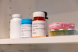 © Raymond Forbes LLC/Stocksy - Prescription pills on shelf in medicine chest