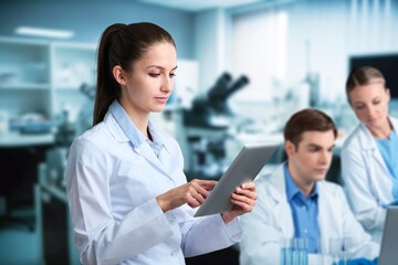 Wall Mural - Science, research workers in laboratory with data.