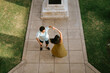 © Mal de Ojo Studio/Stocksy - Couple Dancing and Twirling  in Sunlit Garden
