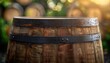© Naret - Close-up of a wooden barrel with blurred background, showcasing the texture and metal bands in natural light.