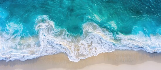 Beach and waves seen from above with turquoise waters and scenic vistas captured from the air by a drone, evoking the essence of travel and the spirit of summer.