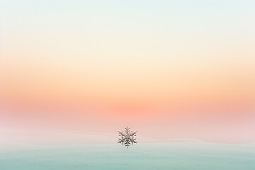 Wall Mural - A serene gradient of dawn colors with a single, delicate silver snowflake at the center