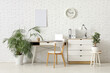 © Pixel-Shot - Interior of stylish office with workplace, laptop, chair and chest of drawers