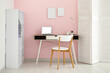 © Pixel-Shot - Interior of stylish office with workplace, laptop, chair and shelving unit