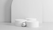 © proDesigner - Background for product showcasing. Three white cylindrical stand on a gray background. 3D rendering.