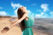 © BillionPhotos.com - Happy woman raising arms enjoying on the beach