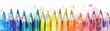 © AshrofS - A vibrant array of colored pencils arranged in a gradient, perfect for art projects, drawing, or school supplies, with a watercolor paint splatter effect.