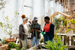 © BONNINSTUDIO/Stocksy - Female and male environmentalists harvesting vegetables at urban farm
