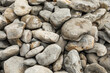 © Lupe Rodríguez/Stocksy - large stones on a beach